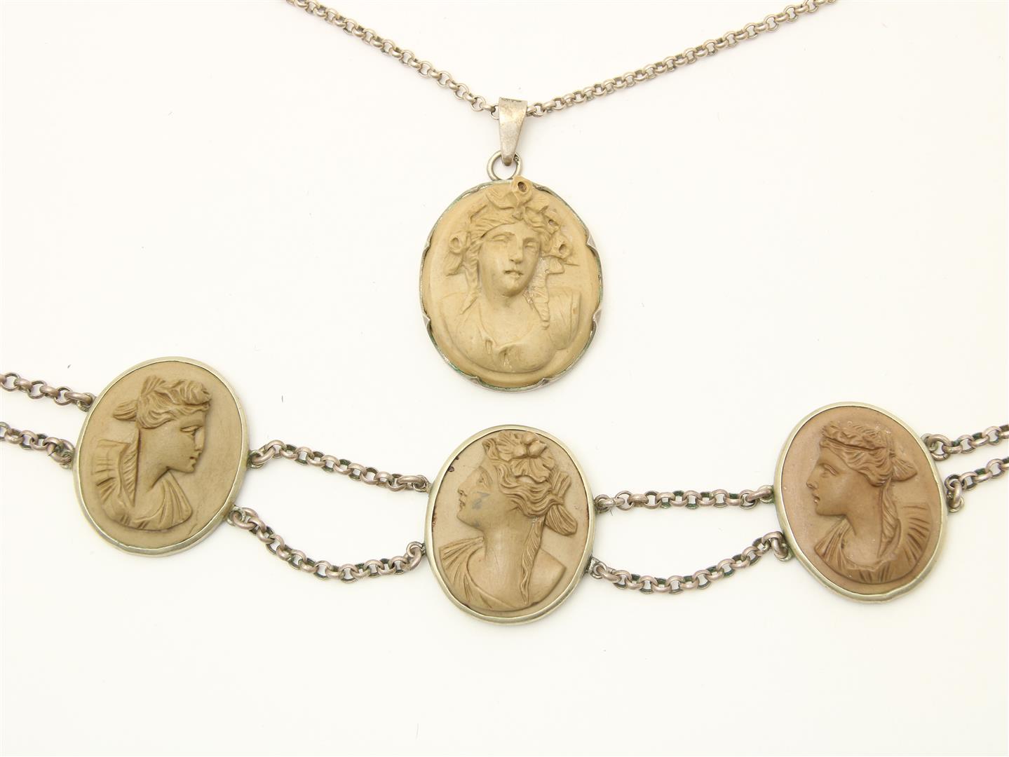 Silver necklace with three lava cameos with images of goddesses in profile, including a silver