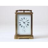 Gilt brass travel clock with enamel dial with Roman numerals and alarm clock with Arabic numerals,