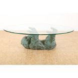 Coffee table with bronze lying bear and glass top, 45 x 80 x 39 cm. (Glass plate with edge flake).