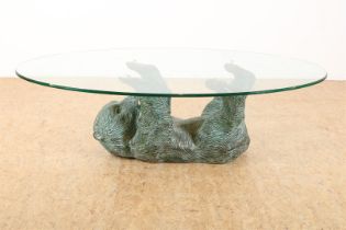 Coffee table with bronze lying bear and glass top
