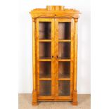 Walnut veneered Biedermeier display cabinet with stepped cornice and 2 partly glass doors flanked by