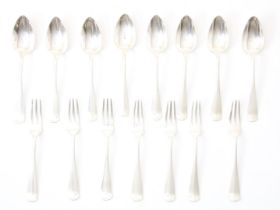 silver cutlery: 7 small forks and 8 small spoons