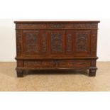 Oak blanket chest with 3 carved front panels, rosette bands and plinth drawer on legs with carved