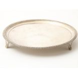 Silver round Georgian tray with ribbed edge on 3 curly legs, England, London, year letter "o", 1789,