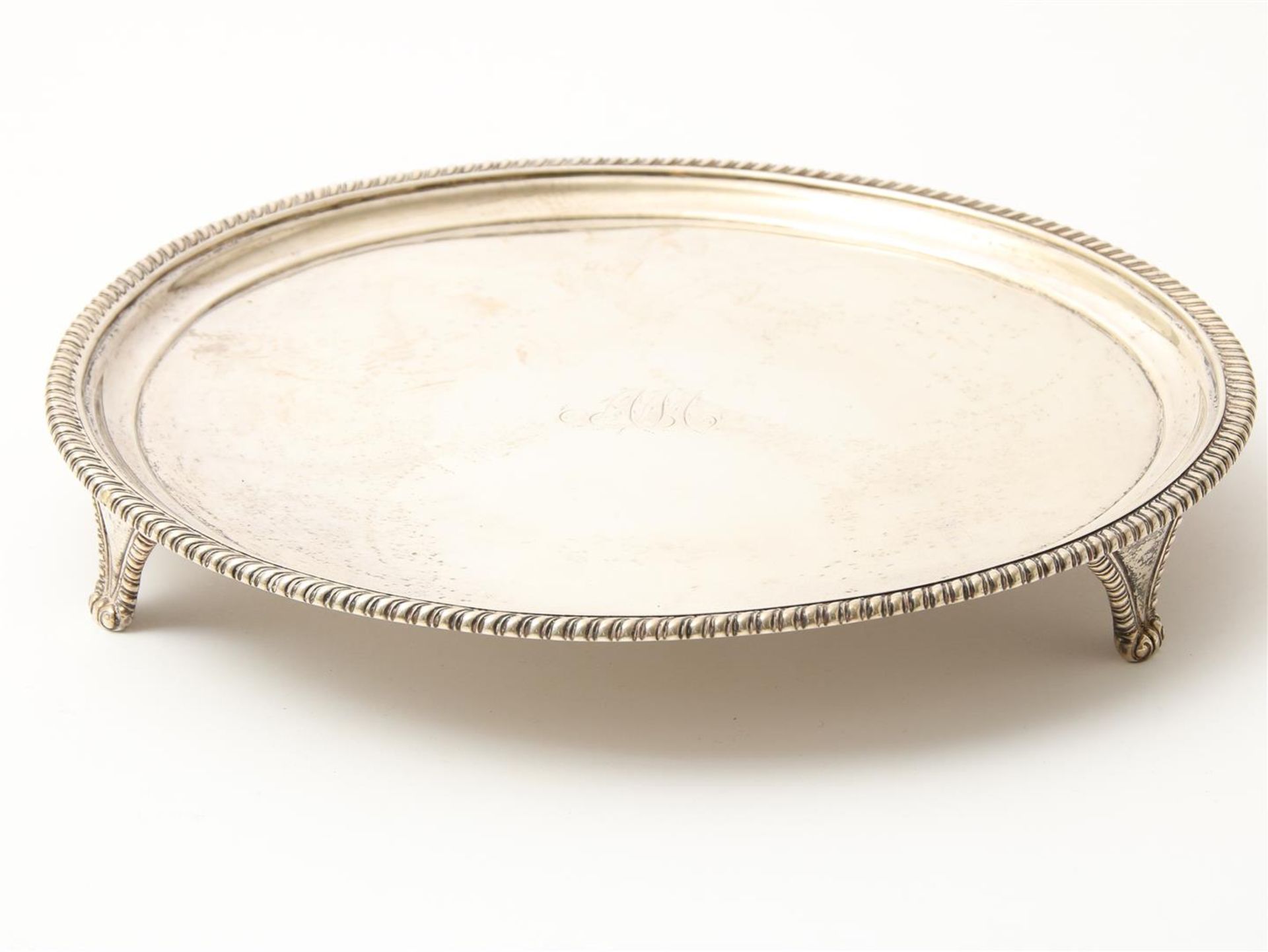 Silver round Georgian tray with ribbed edge on 3 curly legs, England, London, year letter "o", 1789,