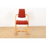 Beech wood balance chair with red upholstery, Peter Opsvik for Stokke Varier, model Aculum, Norway.