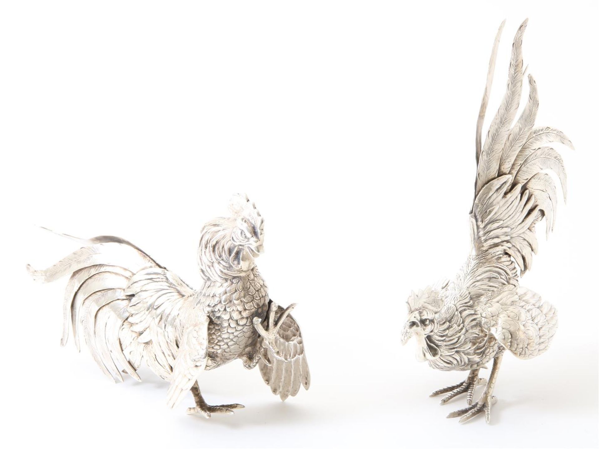 Set of silver fighting cocks, year 1973, grade 835/000, gross weight 850 grams. h.21 cm. and 14 cm.