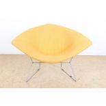 Wire steel design chair with yellow upholstery, designed in 1952 by Harry Bertoia for Knoll.