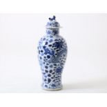 Porcelain baluster dragon vase with cover crowned with lion, decorated in blue with dragon,