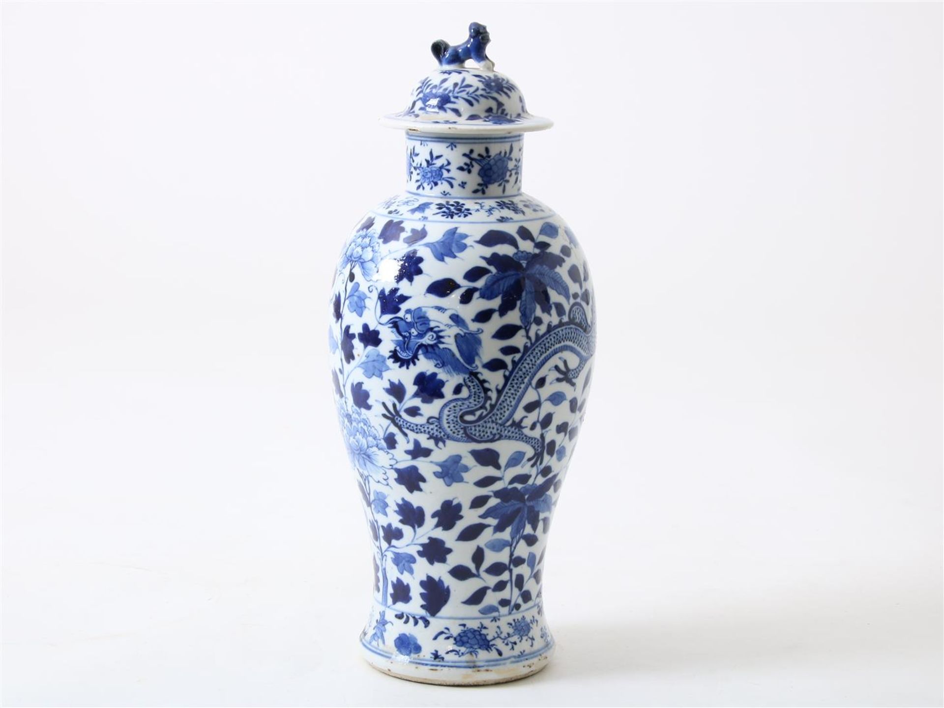 Porcelain baluster dragon vase with cover crowned with lion, decorated in blue with dragon,