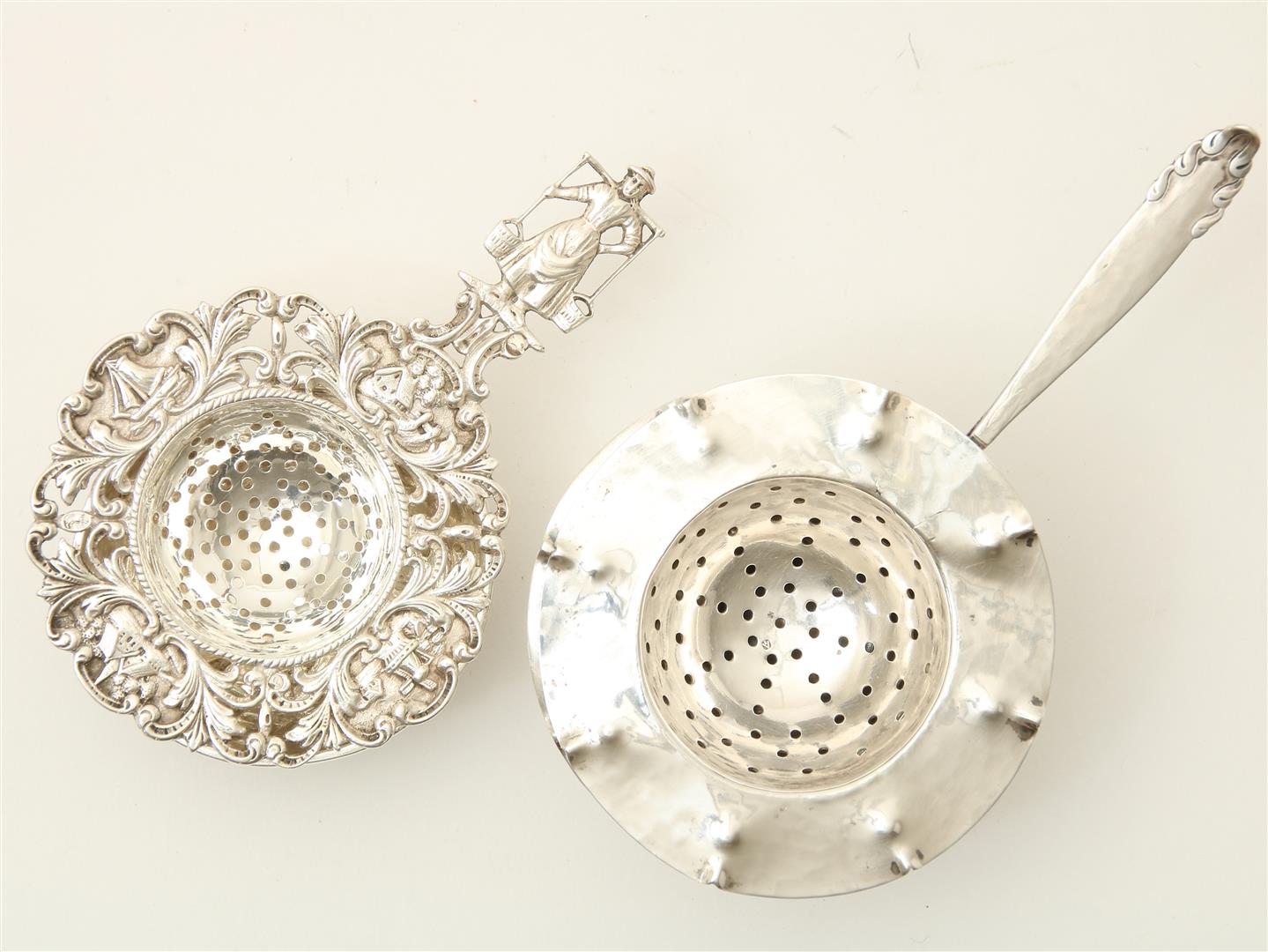 Two silver tea strainers with drip tray, possibly Harm Ellens, gross weight 158 grams.