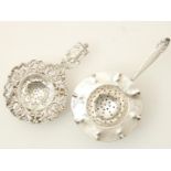 Two silver tea strainers with drip tray, possibly Harm Ellens, gross weight 158 grams.