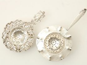 Two silver tea strainers