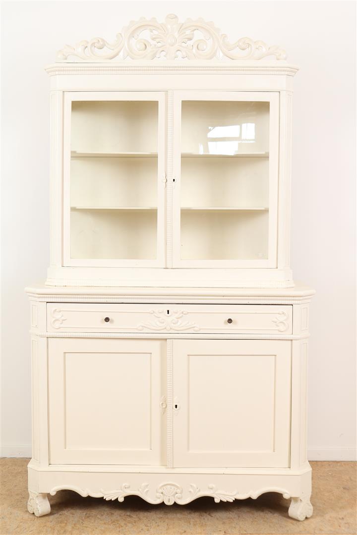 Painted white Biedermeier bonheur with carved crest, 2 glass doors, a drawer and 2 panel doors, 19th