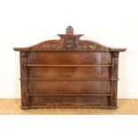 Oak plate rack with wood carvings of lion's head, fruits and satyr heads, 19th century, 64 x 91 x 15