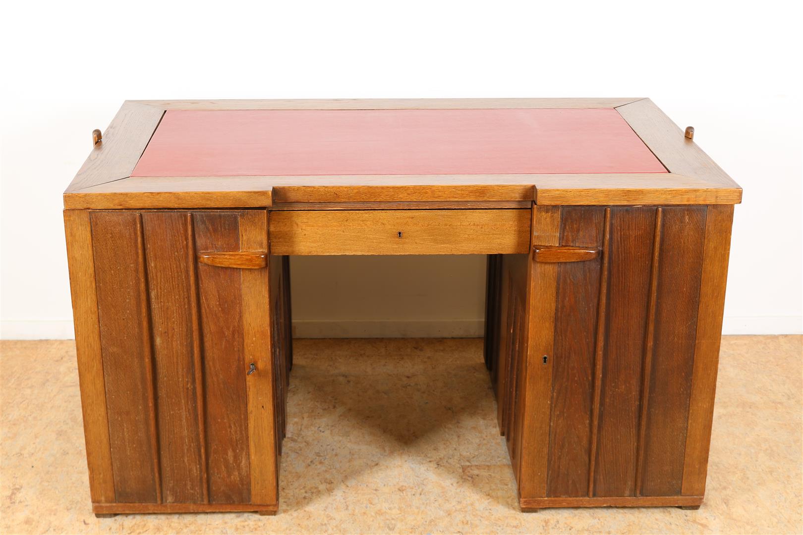 Oak Amsterdam school desk with red leather top, plinth drawer and 2 panel doors and interior with