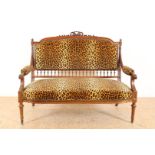 Walnut Louis XVI style double sofa with bow crown and leopard fabric upholstery, 103 x 130 x 58 cm.