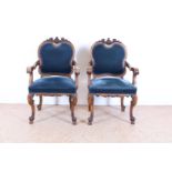 Set of mahogany Louis Philippe armchairs with carved crest and blue velvet upholstery, 19th