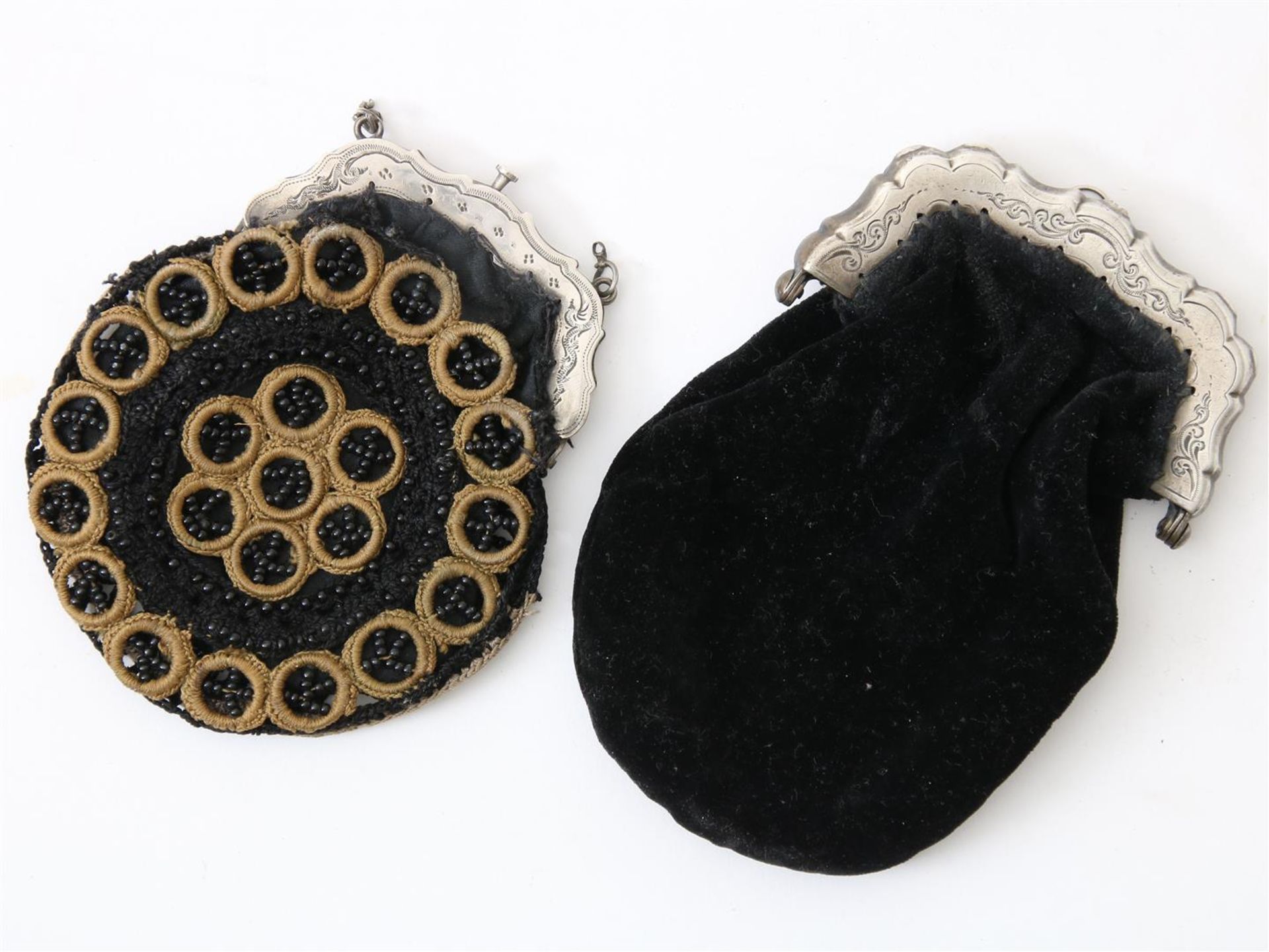 Two silver bag handles, 19th century, with velvet and bead bag.