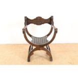 Oak Dagobert armchair with carved maskon in the backrest.