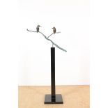 Bronze sculpture of 2 kingfishers sitting on a branch