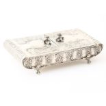 Silver spoon box decorated with flowers, containing various teaspoons