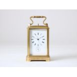 Gilt brass travel clock with enamel dial with Roman numerals and alarm clock with Arabic numerals,