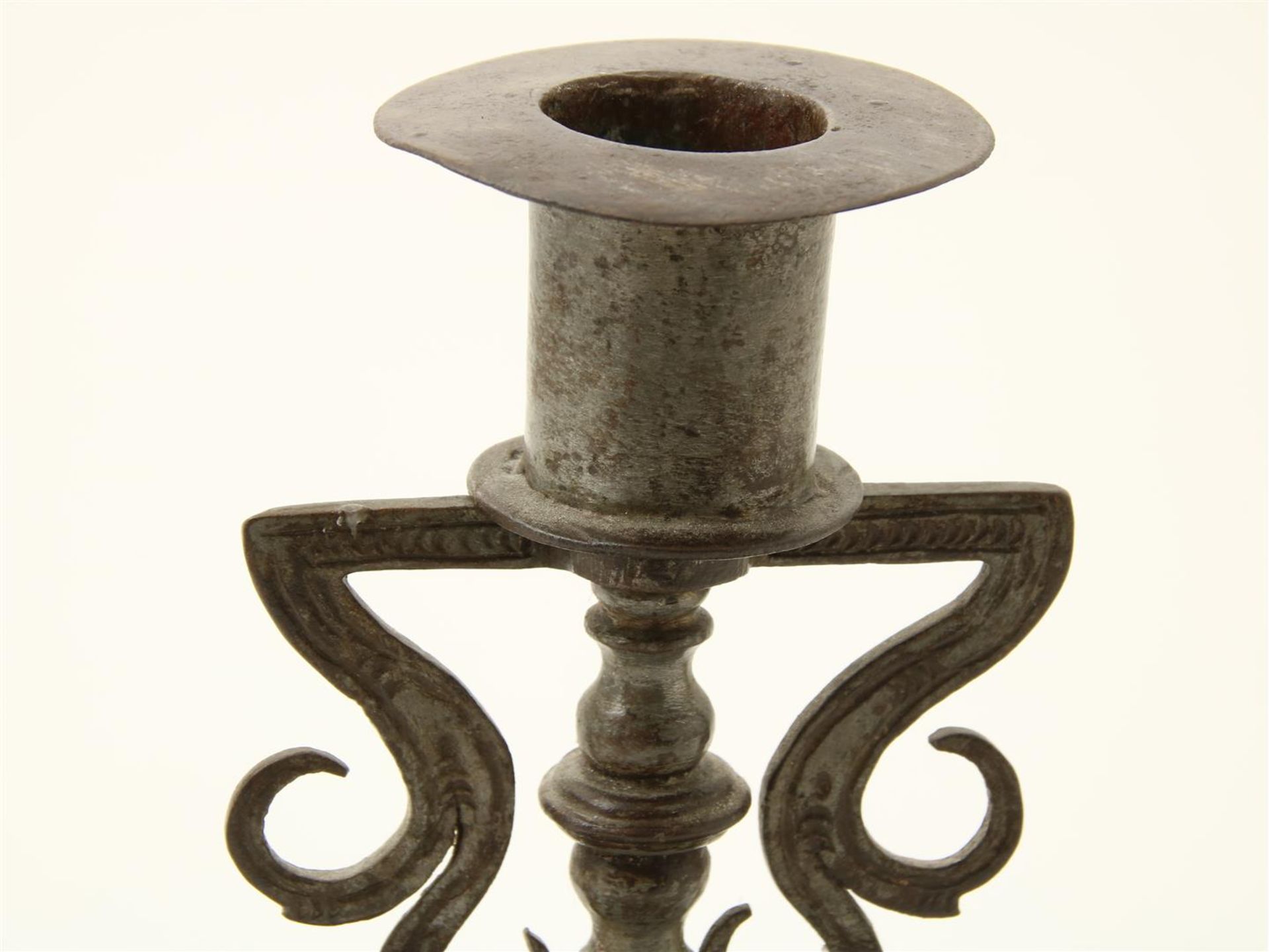 Iron candlestick, decorated with leaf motifs and legs with portraits, possibly Germany, 18th - Image 2 of 4