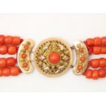 4-row red coral bead necklace with cheese and barrel beads on a gold filigree decorated regional
