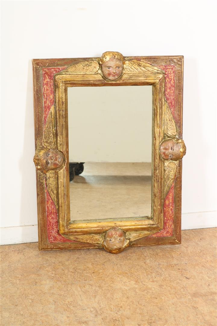 Mirror in wooden and plaster decorated frame with puttos on four sides, Italy, late 18th century,