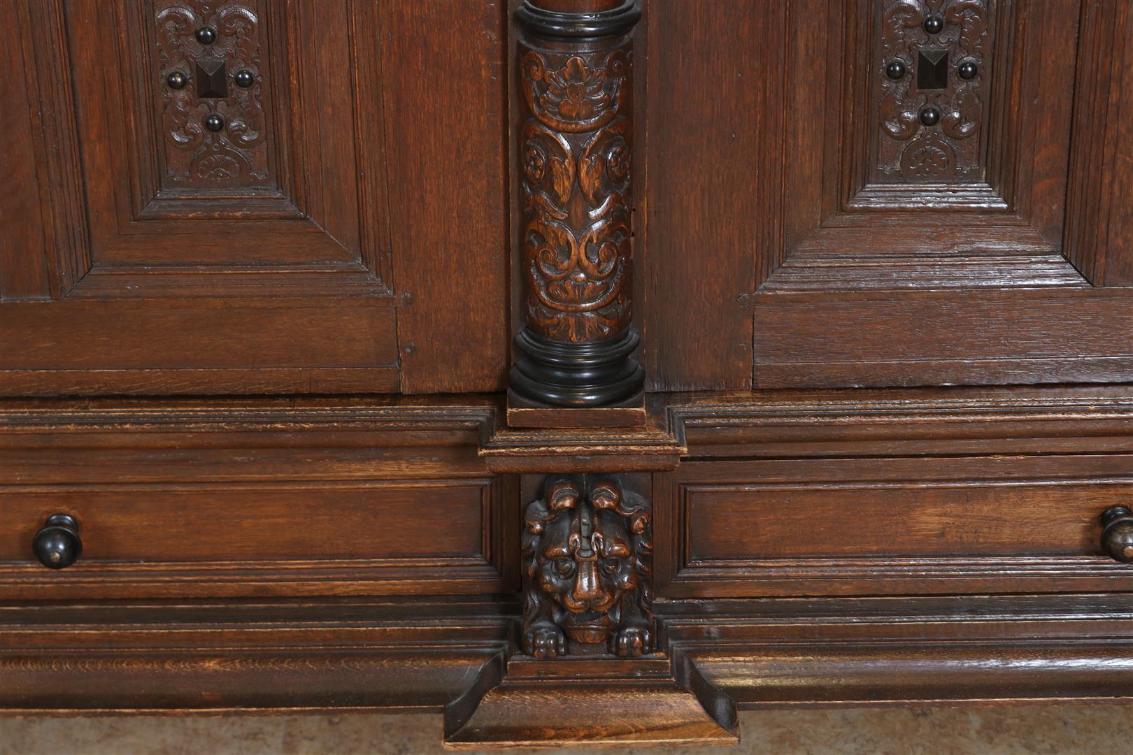 Oak Renaissance cabinet with richly carved crest, recessed elevation with 3 panel doors resting on 4 - Image 8 of 10