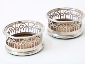 a pair of Victorian silver coasters