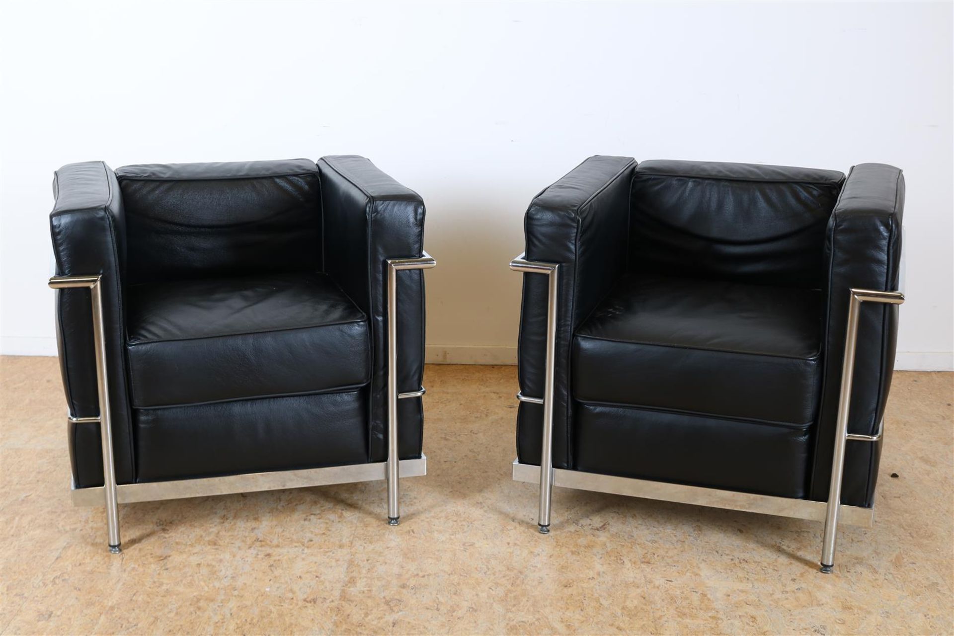 a pair of Corbusier-style fauteuils