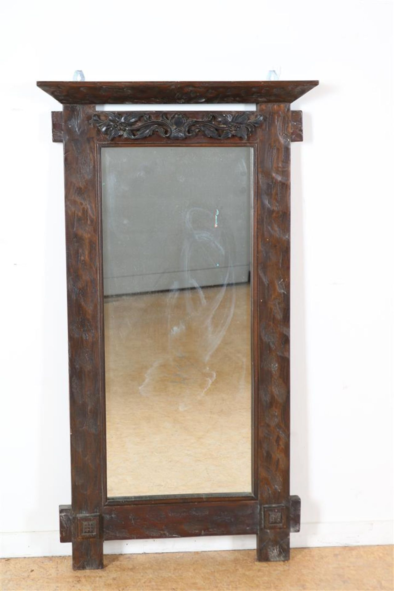 Mirror in teak Art Deco frame with carved flowers, Indonesia, 108 x 60 cm.