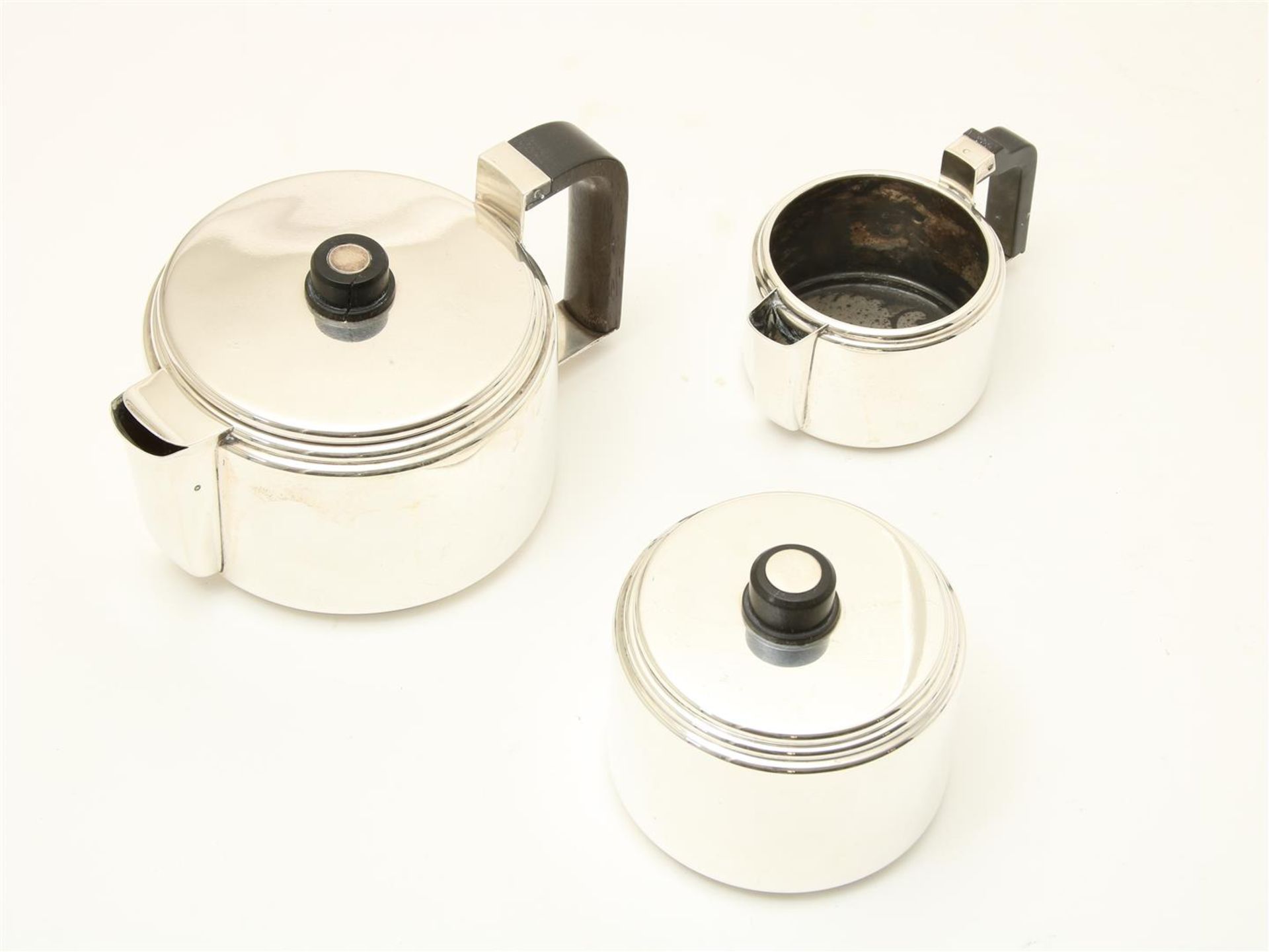 Silver Art Deco tea set with ebony handle and knob, grade 835/000, designer mark: "CE": Christa