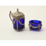 Silver mustard pot and salt shaker with blue glass inner container, Dutch hallmarked.