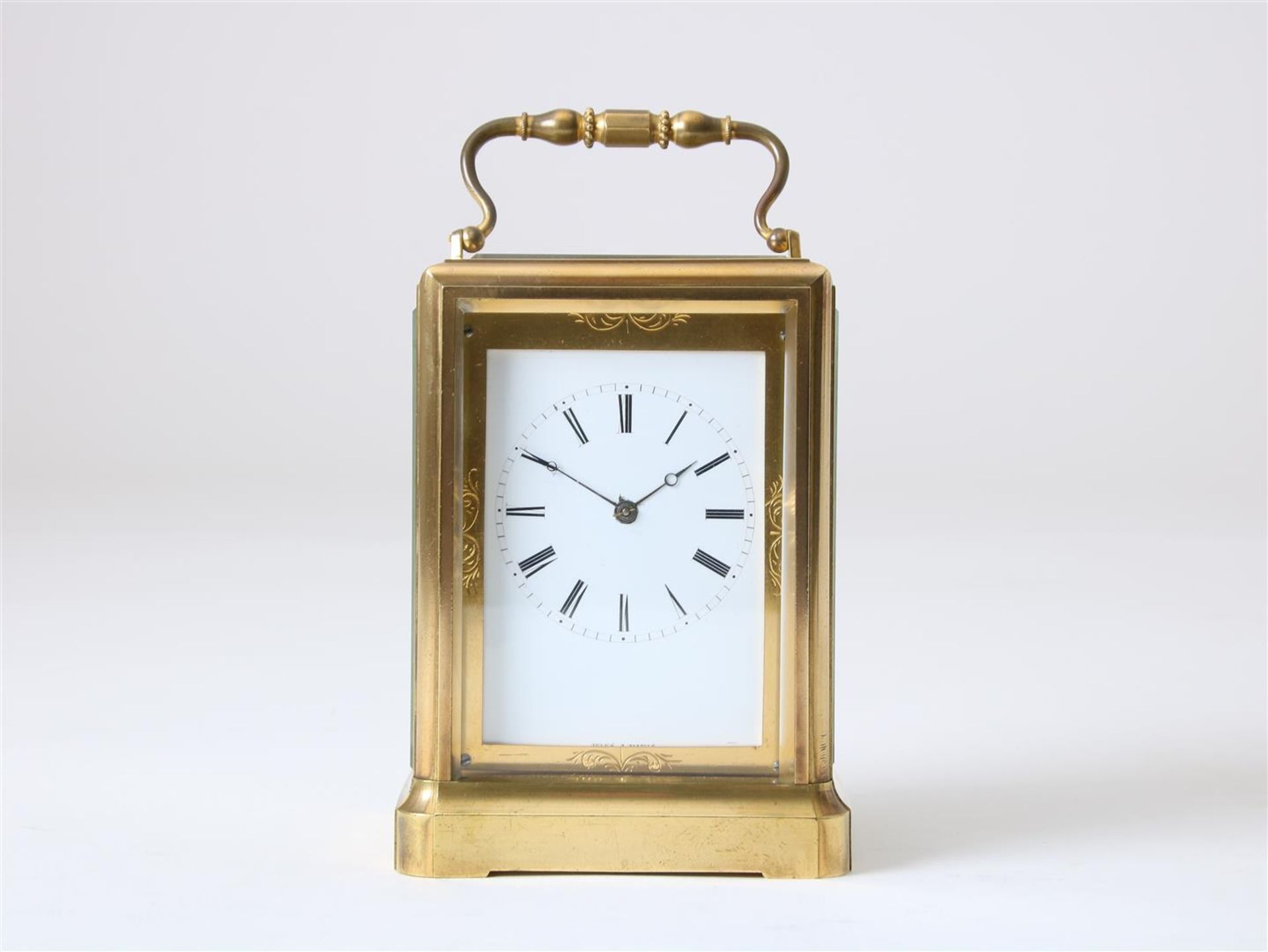 Gilt brass travel clock 'one-piece' with 'Jules escapement', enamel dial with Roman numerals,