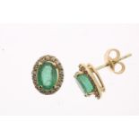 Rose gold entourage ear studs centrally set with an emerald, approximately 1.66 ct. in an