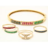 Yellow gold rigid bracelet set with sapphires, rubies, emeralds and diamonds, grade 750/000. And a