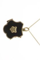 Gold medallion with black enamel