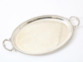 Silver tray with decorative palmette trim and pearl edge