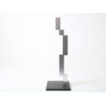 Lon Pennock (1945-2020) 'Stacking', metal sculpture on wooden base, signed below and dated 1981,