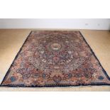 Carpet, Kaschmar 340 x 245 cm. with decorations of flora and fauna, deer, birds and flower vases.