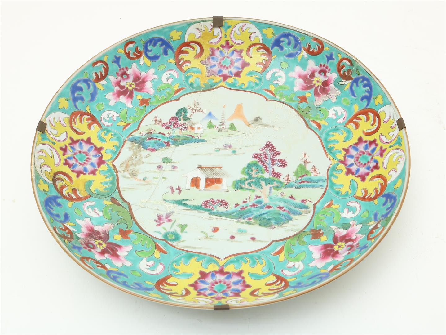 Porcelain famille rose dish with central landscape decor and enamel edge decoration with flowers and