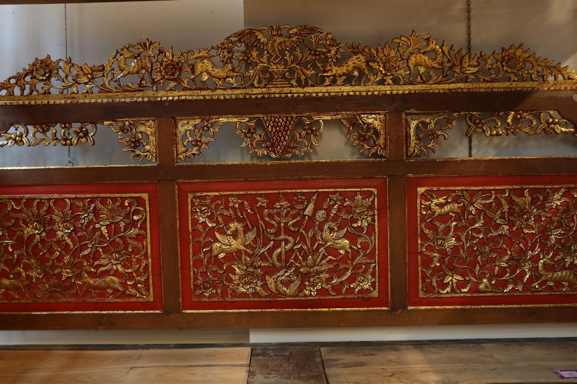 Red and gilded wooden traditional bedstead with carved birds, flowers and dragons, origin Madura, - Image 6 of 6