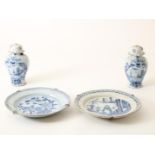 A lot of 2 broken earthenware Delft dishes, 18th century, diameter: 35 cm and 2 Delft earthenware