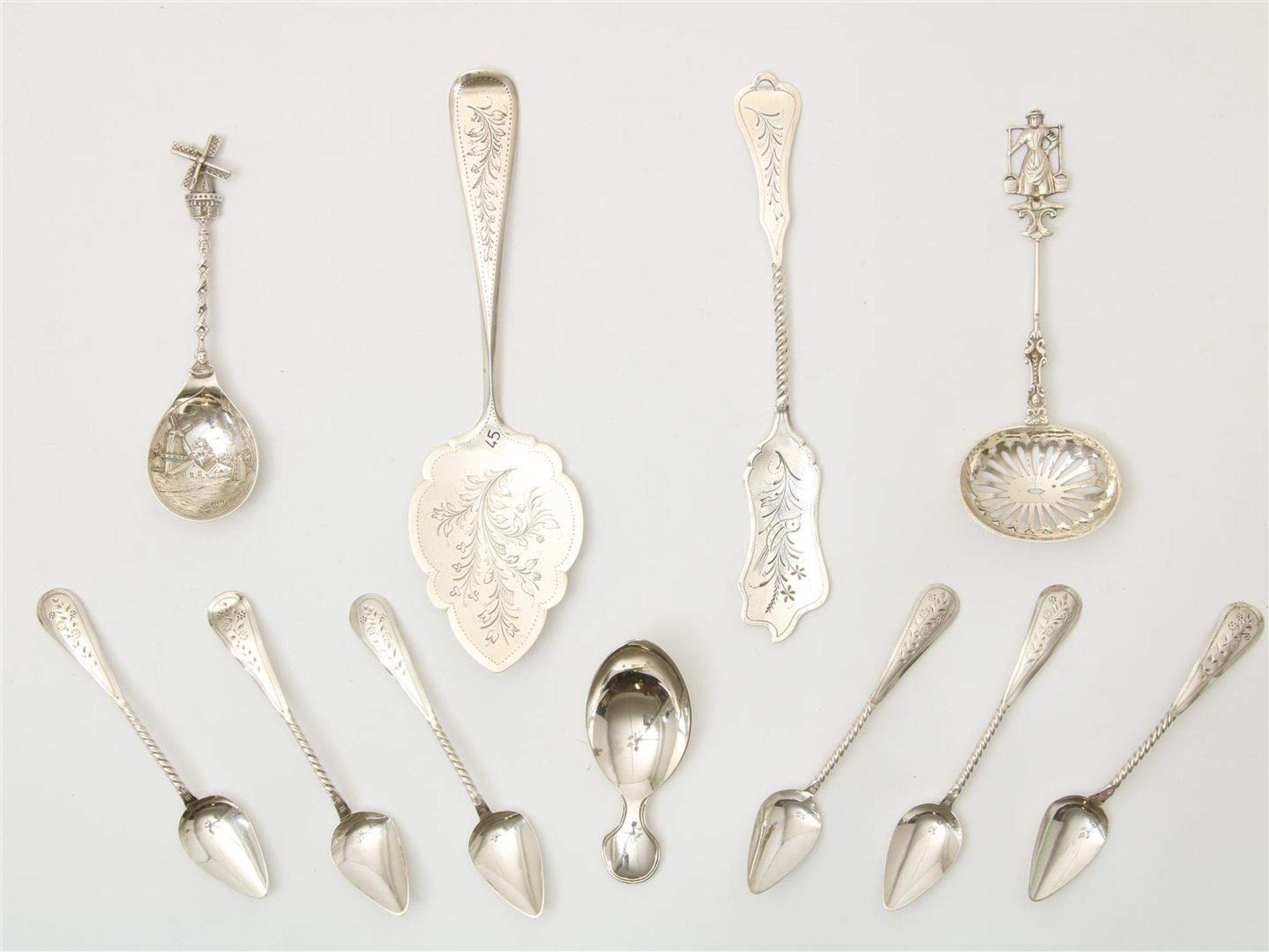 Lot of silver spoons, including 6 teaspoons, cake server and tea thumb, souvenir spoon with