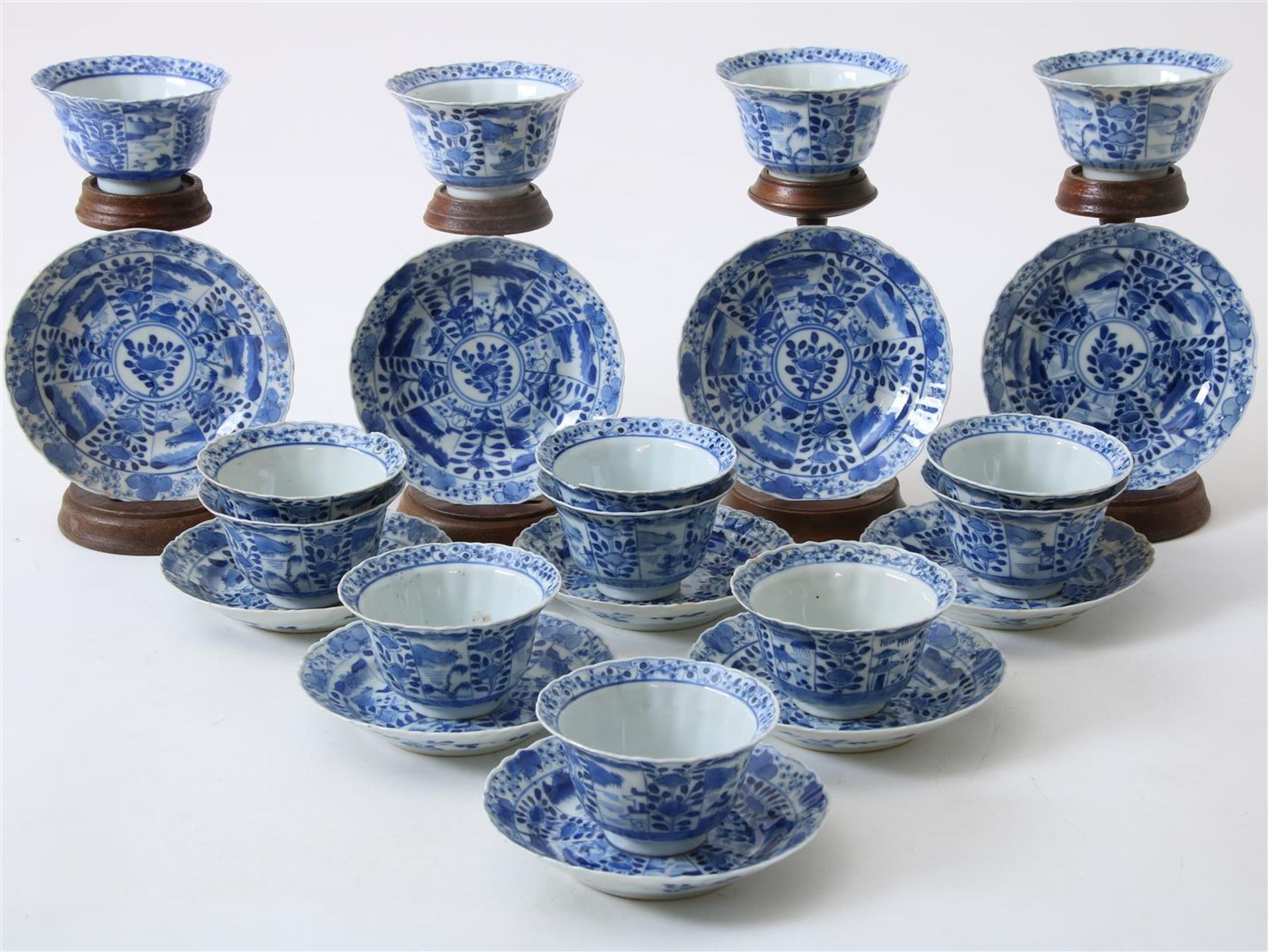 Lot of 13 porcelain cups and 10 saucers decorated with landscapes and parsley decor, Kangxi mark,