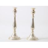 A pair of silver candlesticks