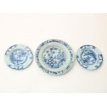 Lot of 3 earthenware plates, 2 with Chinoiserie decor and 1 decorated with flowers, Delft 18th